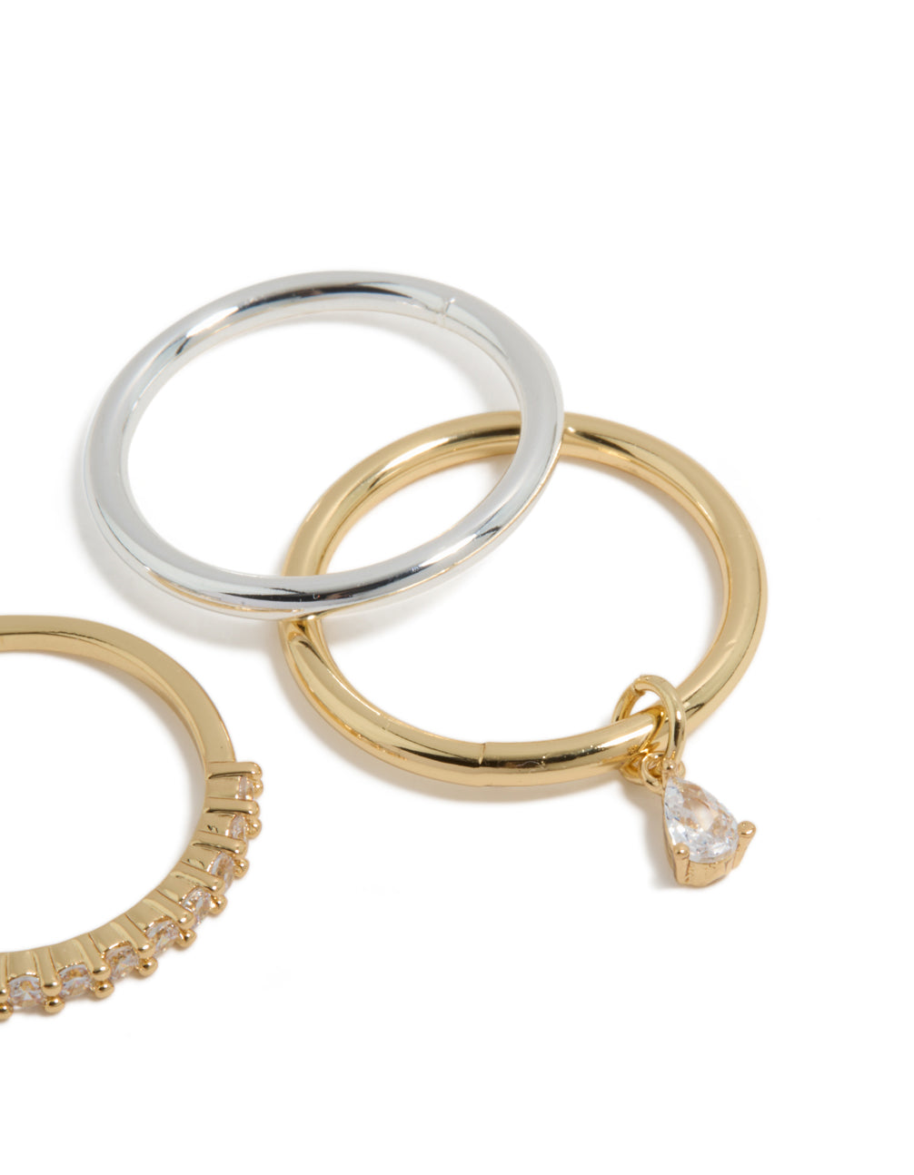 Crafted from mixed metal plated organic cubic zirconia rings 4-pack with charm in gold and silver side detail view