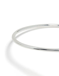 Featuring a molten drop arm cuff in silver plated metal with statement design close up view - link has visual effect only