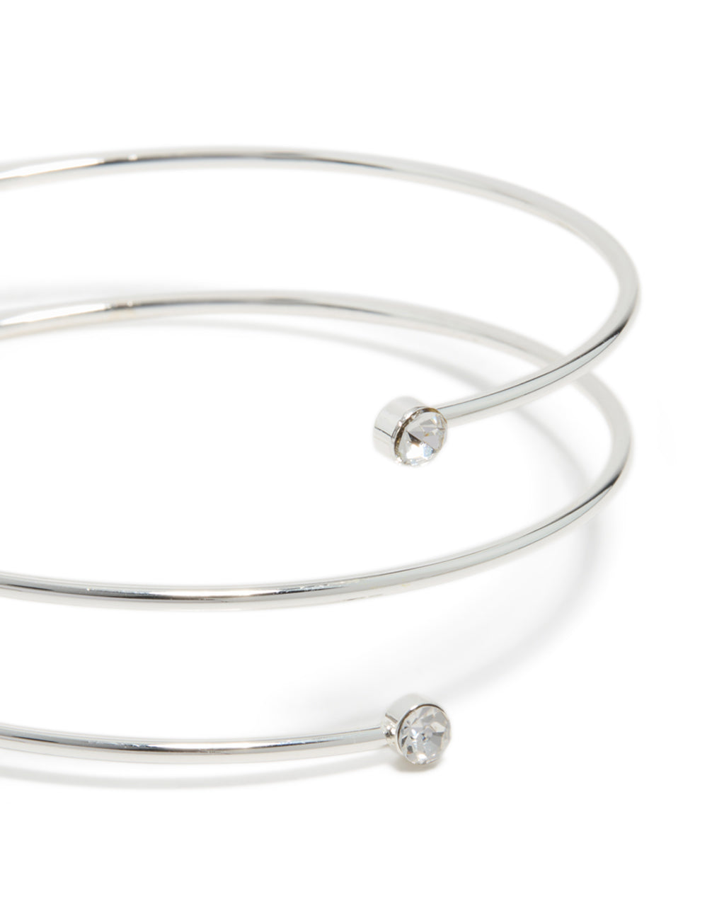 This silver diamante thin wrap arm cuff bangle showcases stone settings in a close up view