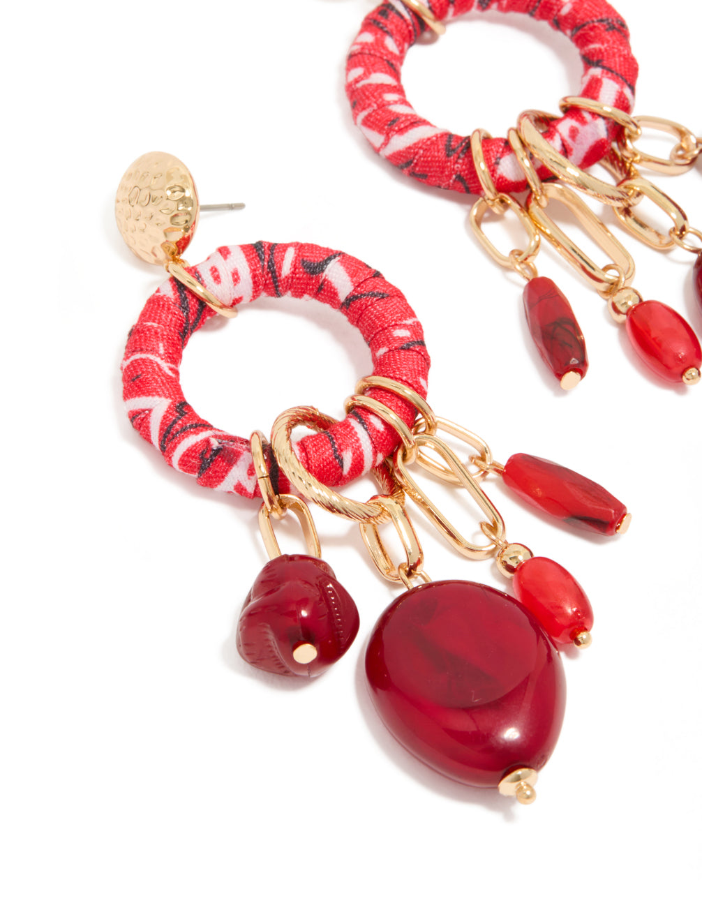 Highlighting statement drop earrings with gold beaded paper wrapped hoops, charm in red and maroon close up view