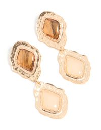 Crafted with statement style, these gold molten Aztec drop earrings feature a bold design front view - link has visual effect only