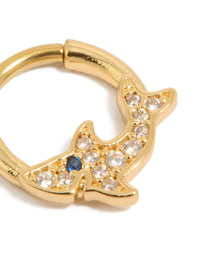 Highlighting a statement shark clicker ring made from surgical steel with cubic zirconia embellishments in gold plated finish featuring ocean motif detail view - link has visual effect only