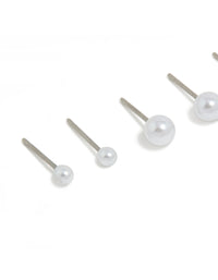 Highlighting surgical steel graduating pearl stud earrings in white and silver with 3-pack close up view - link has visual effect only