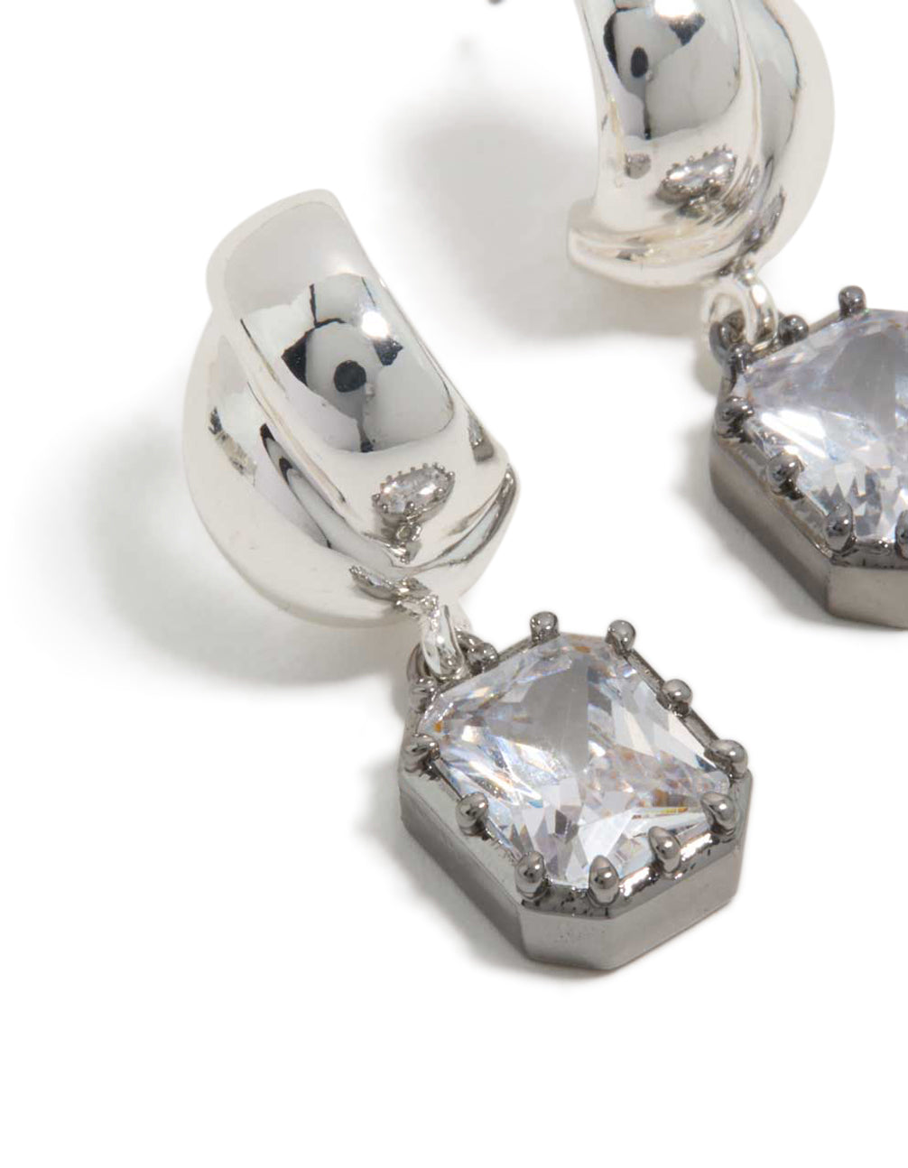 Highlighting silver and gunmetal plated cubic zirconia square drop earrings with statement style close up view