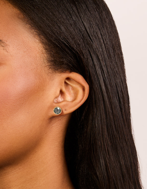 Featuring gold plated cubic zirconia circle stud earrings with crystal in a 3-pack on ear view