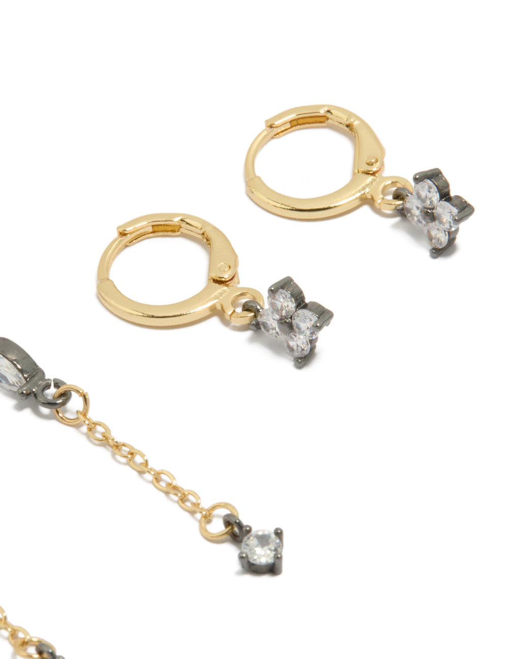 Highlighting mixed metal cubic zirconia flower chain and huggie earrings in a 3-pack post detail view