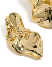 Showcasing gold plated wavy organic drop stud earrings with sculptural texture close up view - link has visual effect only
