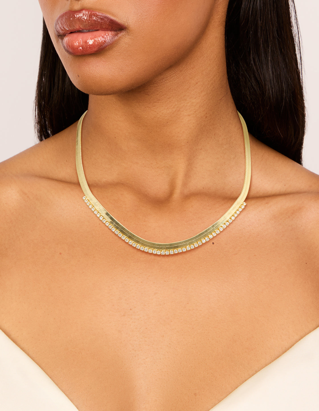 Sophisticated gold plated cubic zirconia necklace with snake chain in statement style on neck view