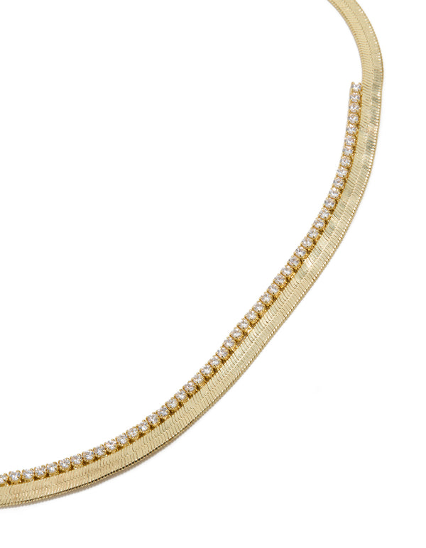 Showcasing a gold plated cubic zirconia necklace with snake chain close up view