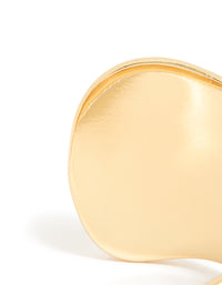 Crafted from gold plated material, this wide organic wrist cuff features statement bangle design closure detail view - link has visual effect only