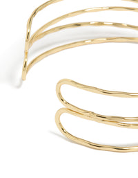 This gold plated multi cross textured arm cuff in statement style displays closure detail view - link has visual effect only