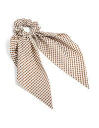 Showcasing a checkered fabric scrunchie scarf in saddle brown and white front view - link has visual effect only