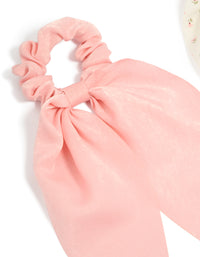 Crafted with bow detail in floral pattern, this 2-pack set features light pink, ivory, pink, and olive printed flowers and fabric scarf scrunchies detail view - link has visual effect only