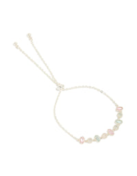 Featuring a silver plated oval and round cubic zirconia tennis toggle bracelet front view - link has visual effect only