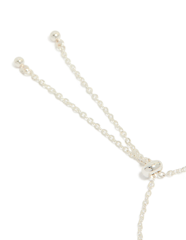 Showcasing the silver plated oval and round cubic zirconia tennis toggle bracelet closure detail view