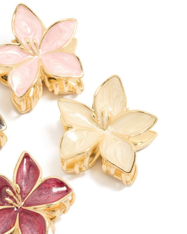 Designed with gold pink burgundy enamel frangipani claw clips in a 4-pack showcasing floral design and glitter accents side view
