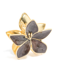 Featuring a floral frangipani design, this enamel claw clip showcases marbled brown in gold side view - link has visual effect only
