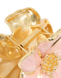 Elegant floral enamel blossom hair claw clip in light pink and gold detail view - link has visual effect only
