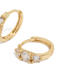 Elegant gold plated mixed sized cubic zirconia mini huggie earrings crafted with huggie closure post detail view - link has visual effect only