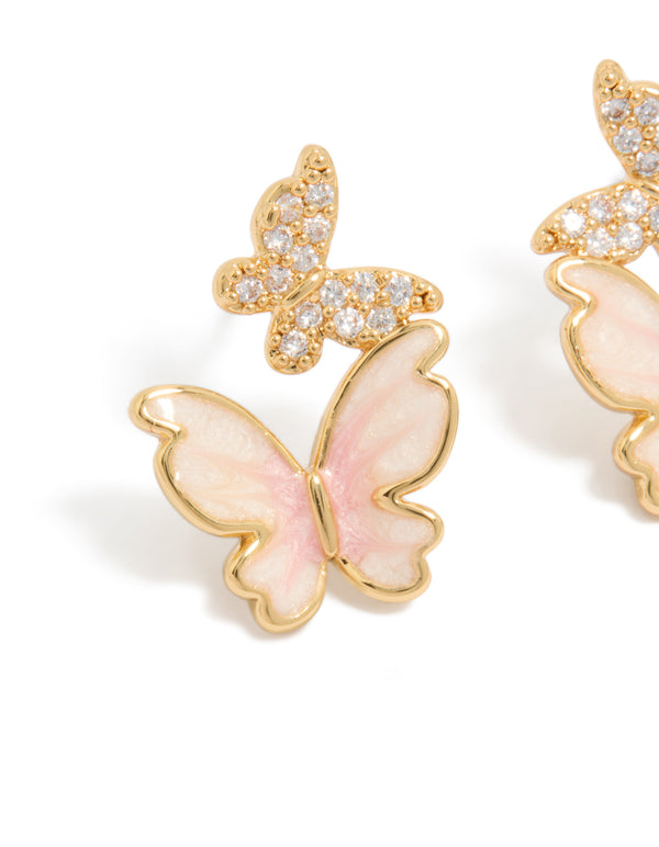 Capturing small butterfly stud earrings in gold plated finish with pink enamel and cubic zirconia close up view