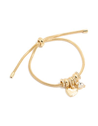 Showcasing a gold plated cubic zirconia chunky heart charm toggle bracelet with statement design front view - link has visual effect only