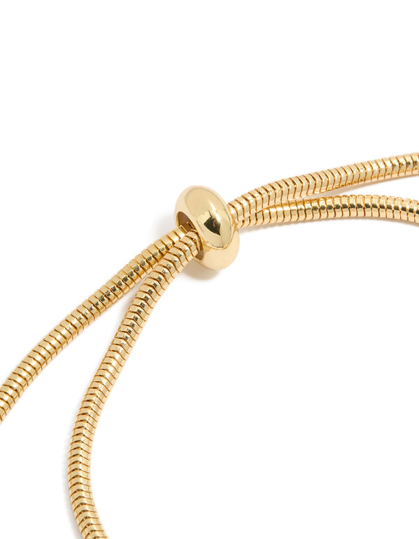 Crafted from gold plated cubic zirconia chunky heart charm toggle bracelet with statement design closure detail view