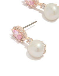Elegant rose gold plated cubic zirconia freshwater pearl halo drop earrings with statement design close up view - link has visual effect only