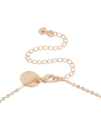 Highlighting a vine spaced necklace with floral and leaf elements, crafted from cubic zirconia in rose gold plated finishes, statement styled clasp detail view - link has visual effect only