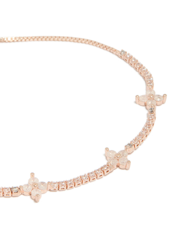 Featuring floral design with cubic zirconia in rose gold plated toggle bracelet close up view