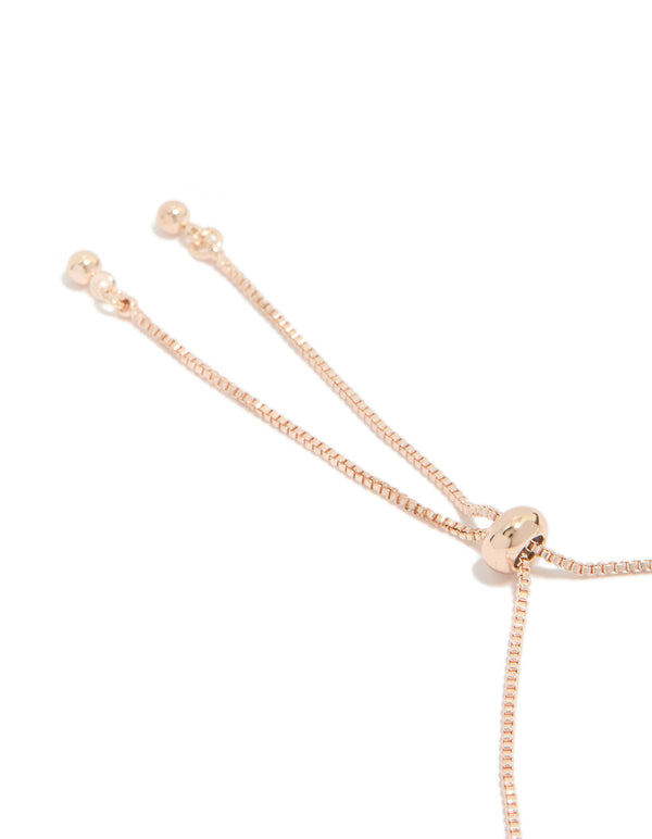 Designed with cubic zirconia flowers in rose gold plated toggle bracelet closure detail view