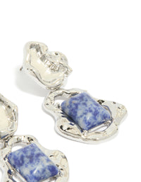 Elegant silver molten semi precious stone drop earrings highlighting blue gemstones in post detail view - link has visual effect only