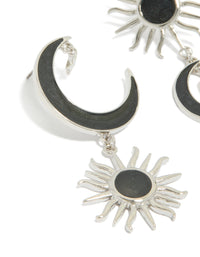 Beautifully crafted statement silver black drop earrings featuring moon and sun celestial design with pearl accents close up view - link has visual effect only