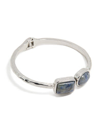Showcasing a silver double blue stone bangle front view - link has visual effect only