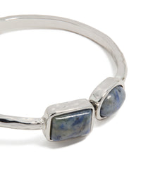 Featuring a silver double blue stone bangle close up view - link has visual effect only