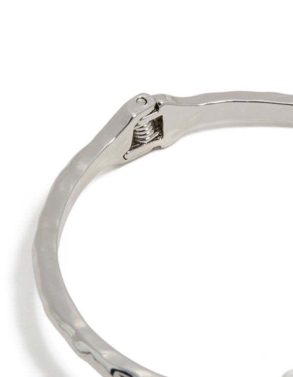 Crafted from silver, this double blue stone bangle closure detail view