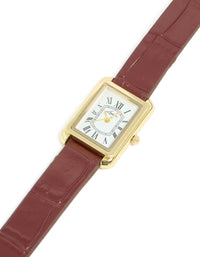 Discover a women's analog watch with white roman dial, rectangle shape, brown leather strap, and gold accents crafted from PU material for formal occasions front view - link has visual effect only
