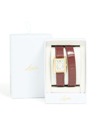Highlighting a women's analog watch with white roman rectangle dial, brown leather strap, and gold PU material designed for formal events case detail view - link has visual effect only