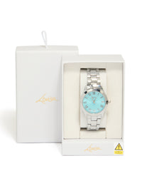 Elegantly presented women's watch with roman numeral blue dial, round shape, casual analog design, link band strap in silver case detail view - link has visual effect only