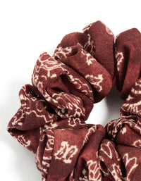 Crafted statement fabric scrunchie features paisley design in maroon beige tones side view - link has visual effect only