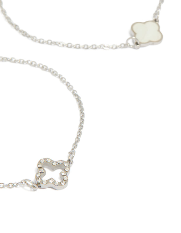 Featuring waterproof stainless steel cubic zirconia flower bracelets in a 2-pack with crystal accents, and silver ivory tones close up view