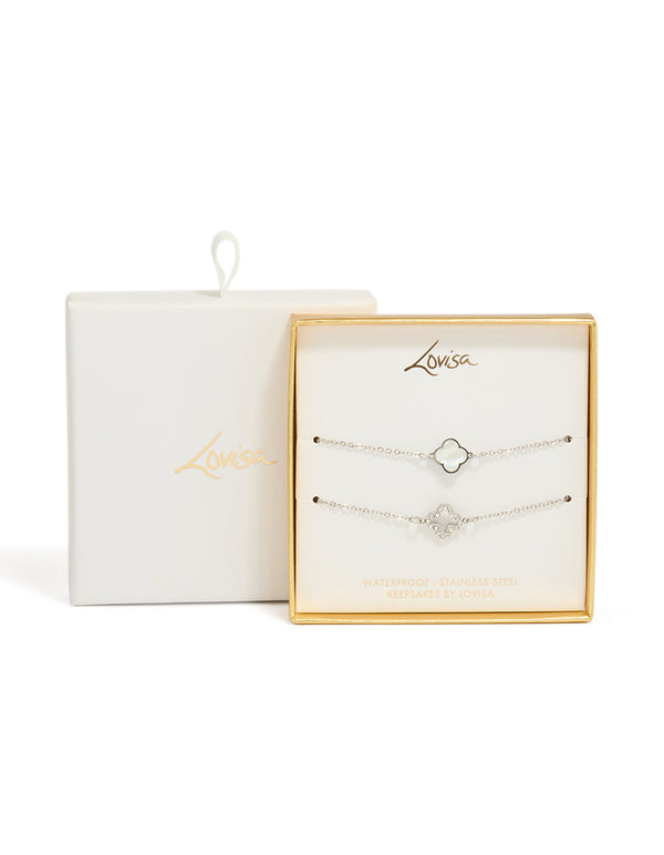 Featuring waterproof stainless steel cubic zirconia flower bracelets in a 2-pack with crystal accents, and silver ivory tones close up view