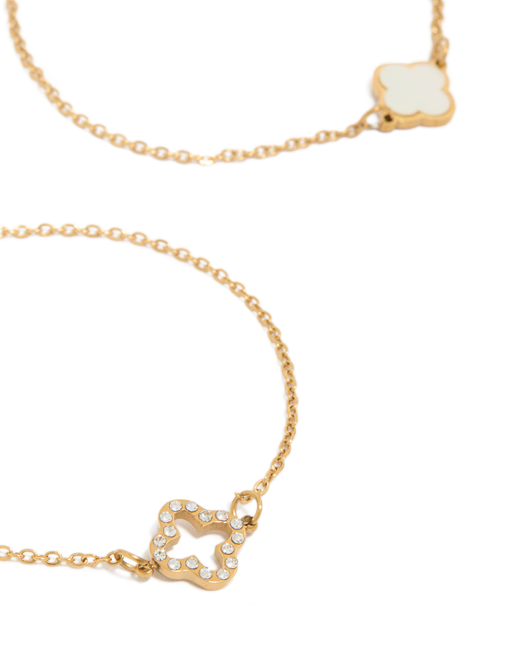 Showcasing waterproof floral bracelets crafted from stainless steel with cubic zirconia in dainty gold plated style 2-pack close up view