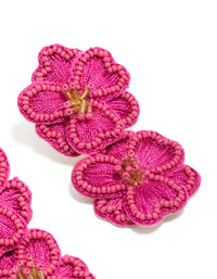 Featuring statement hot pink fabric beaded double flower drop earrings post detail view - link has visual effect only