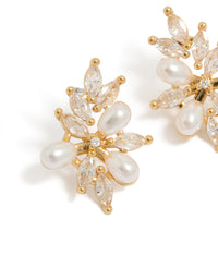 Beautifully designed organic flower statement earrings with gold plated metal, pearls, and cubic zirconia in ivory tones close up view - link has visual effect only