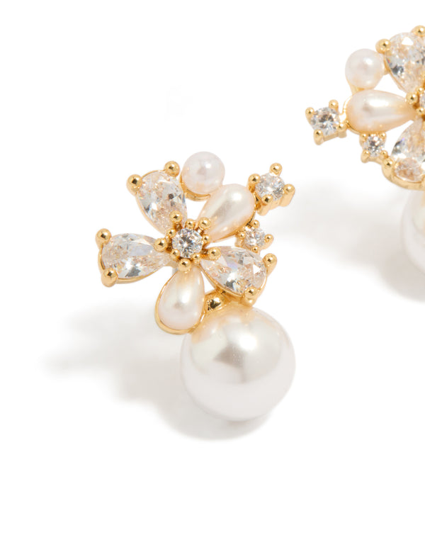 Elegant gold plated cubic zirconia laurel and pearl flower hoop earrings featuring floral design in ivory close up view
