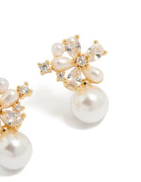 Highlighting gold plated cubic zirconia laurel and pearl flower hoop earrings with floral accents in ivory post detail view - link has visual effect only