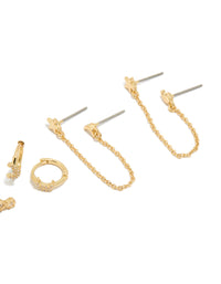 Capturing gold plated celestial moon earrings with cubic zirconia, star accents in a 4-pack including huggie and stud closures post detail view - link has visual effect only