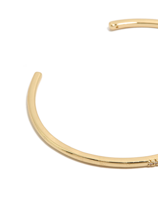 Featuring a gold plated cubic zirconia thin wrist cuff bangle closure detail view