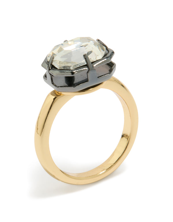 Displaying a gold plated cubic zirconia mixed metal statement ring featuring crystal detailing in silver with chunky construction side detail view