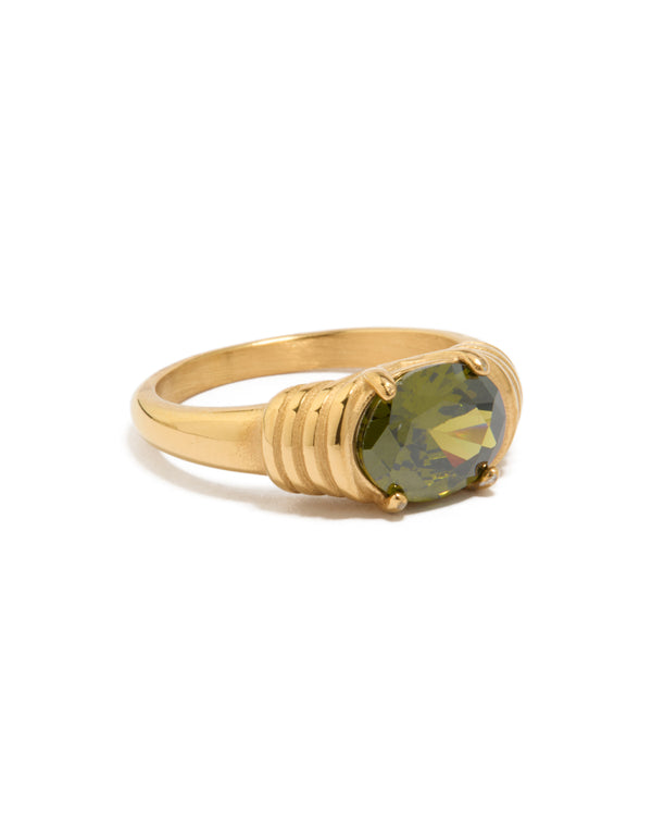 Showcasing a waterproof ring with oval cut green cubic zirconia in dainty gold plated stainless steel and crystal accents side detail view